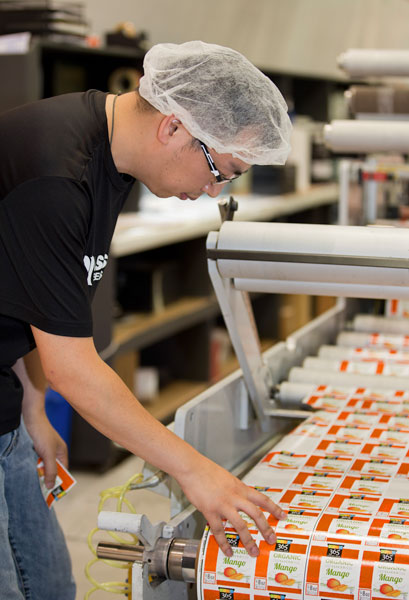 Man performing quality inspection on labels
