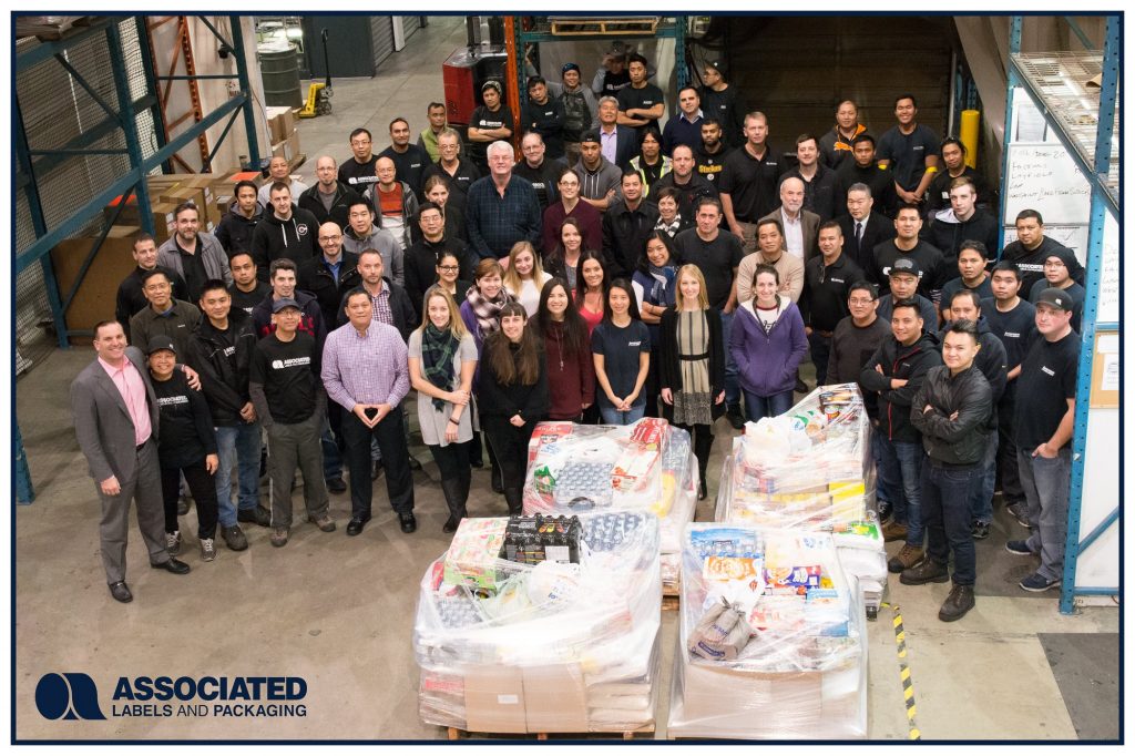 Our staff, with big pile of donated food